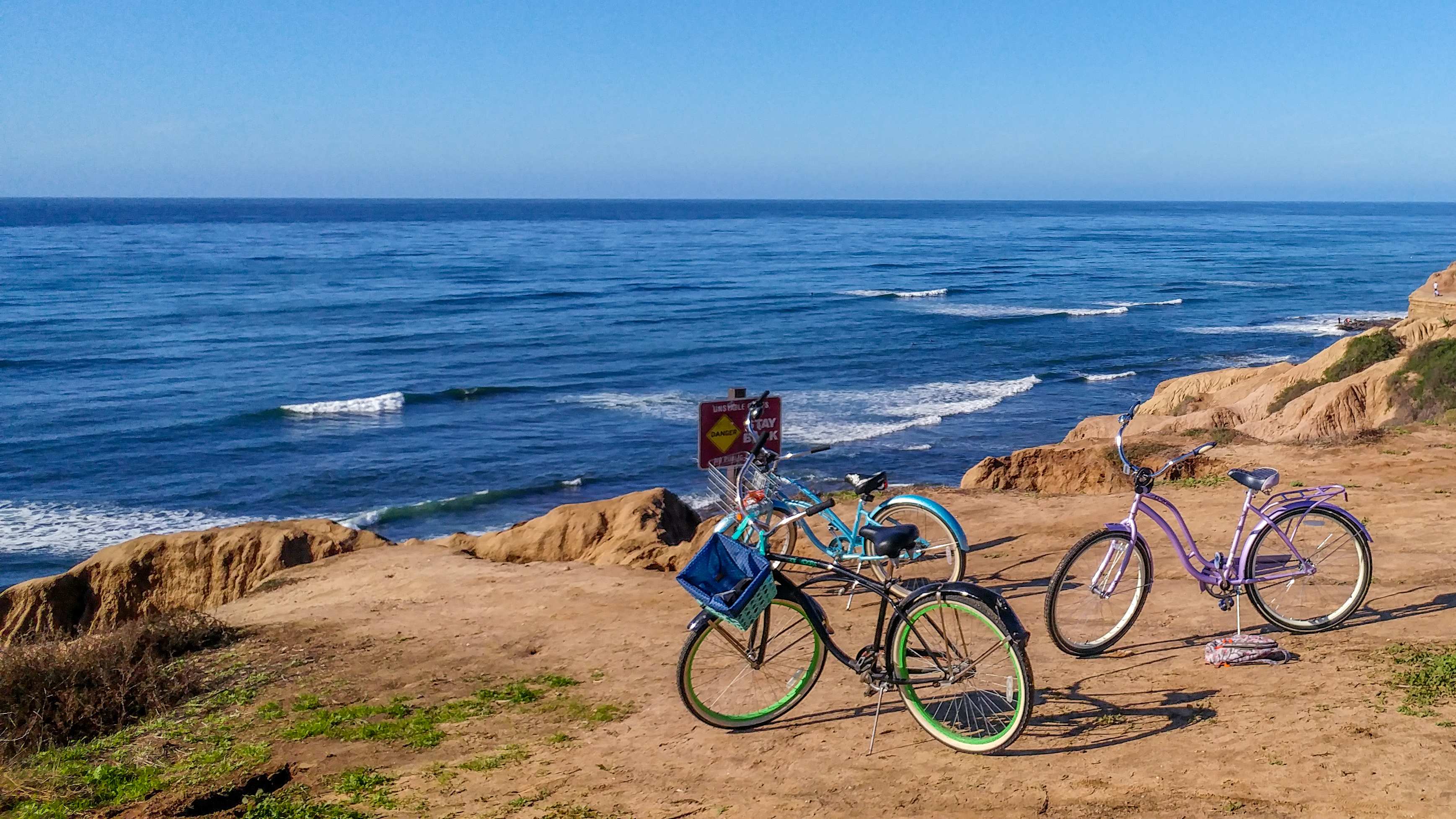 Two beach cruisers near sunset cliffs